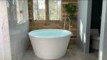 luxury bathtub large bathtub round tub round bathtub gold bathtub bathroom wood wall bathroom plant wall marble tile